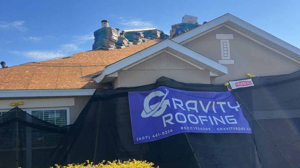 Gravity Roofing team performing roof decking and material staging during a roof replacement project in Central Florida