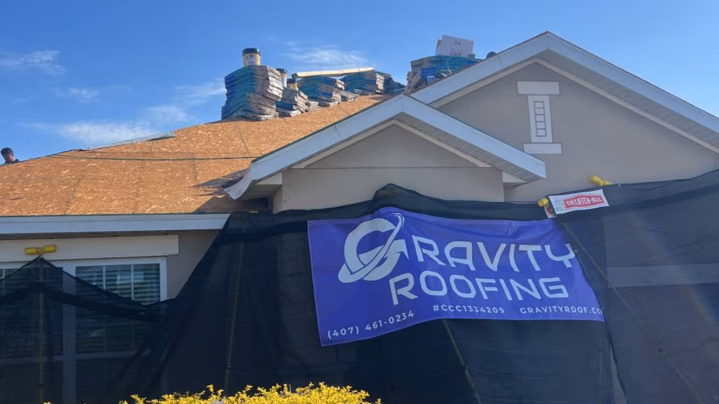 Gravity Roofing team performing roof decking and material staging during a roof replacement project in Central Florida