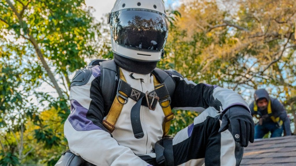 Gravity Roofing's astronaut mascot performing a roof inspection in Central Florida