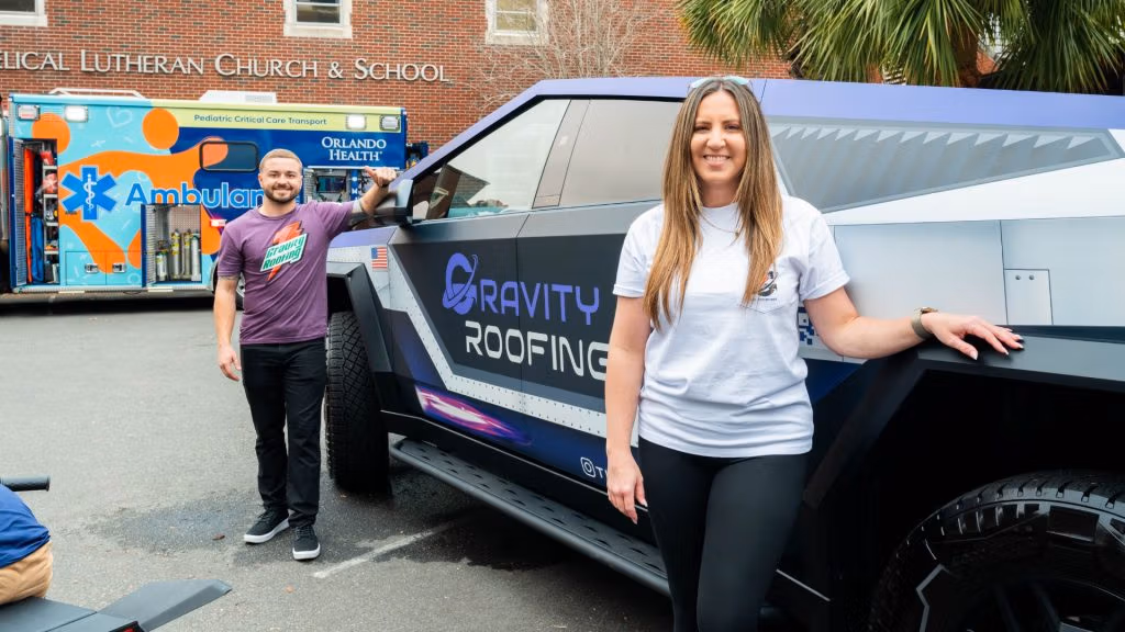 Gravity Roofing team with their Gravitron truck at Touch-A-Truck 2025 at Trinity Downtown Lutheran Church and Child Development Center in Orlando, Florida