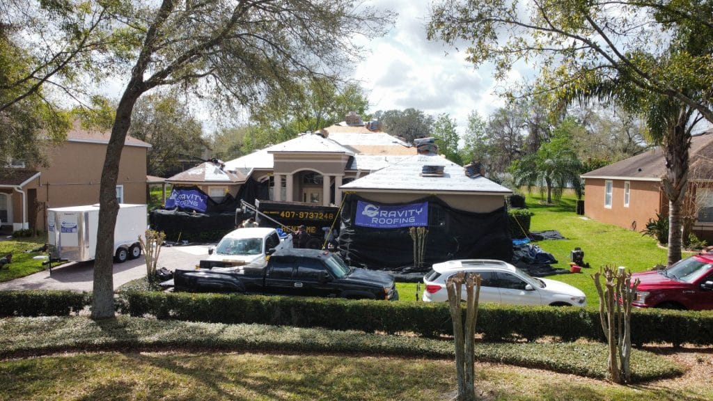 Residential roof replacement in progress with Gravity Roofing team and equipment