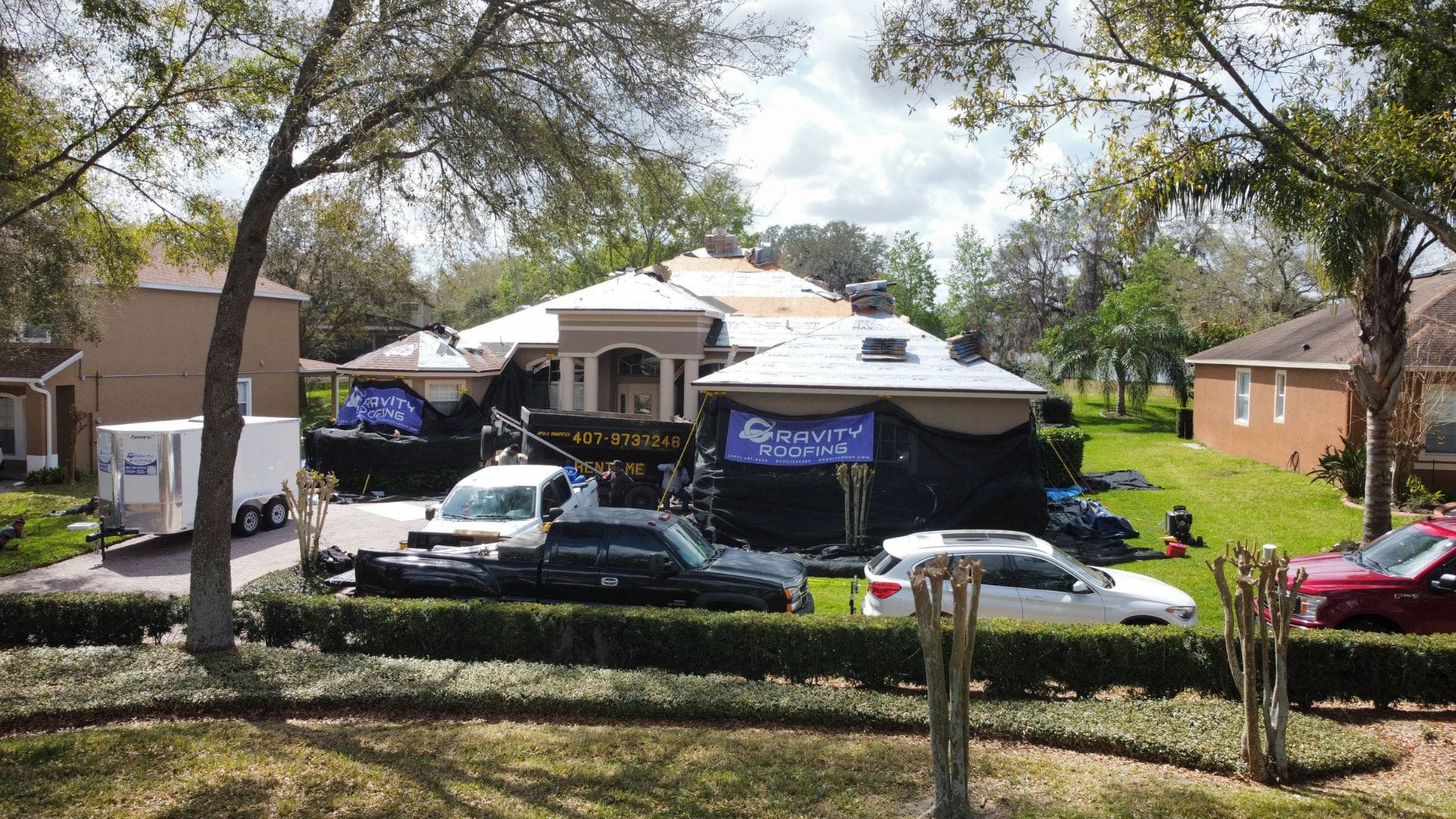 Residential roof replacement in progress with Gravity Roofing team and equipment