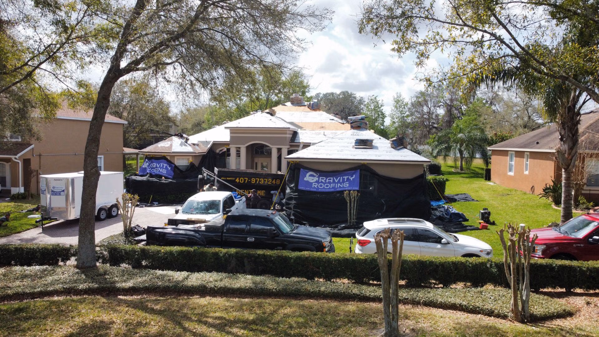 Residential roof replacement in progress with Gravity Roofing team and equipment