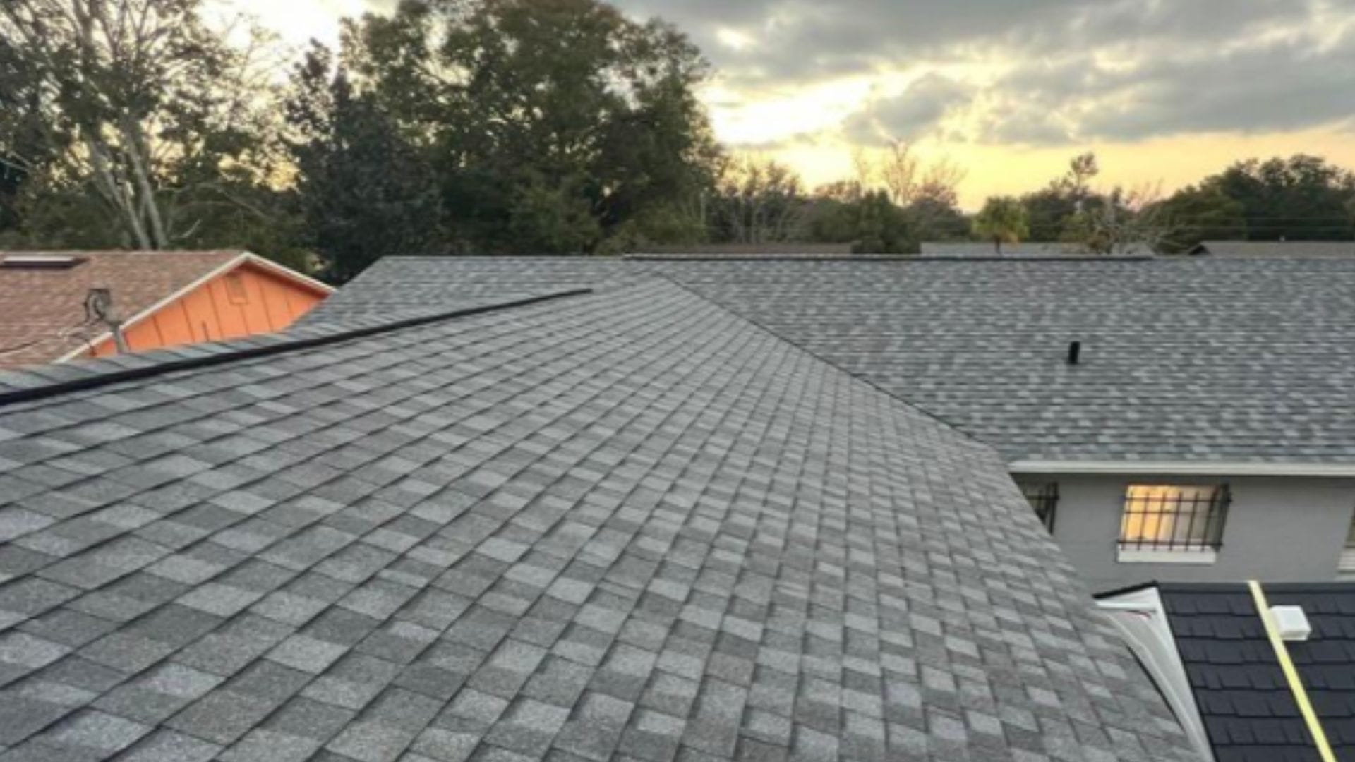 Roof inspection Sorrento — roofing expert inspecting shingles on a Florida home after storm season.