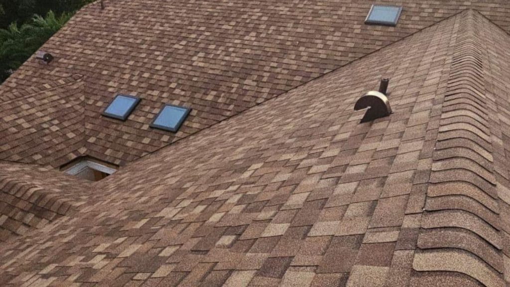 Roof inspection The Villages — roofing expert inspecting shingles on a Florida home after storm season.